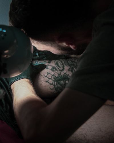 Close-up on a man's focused expression during a workout session.
